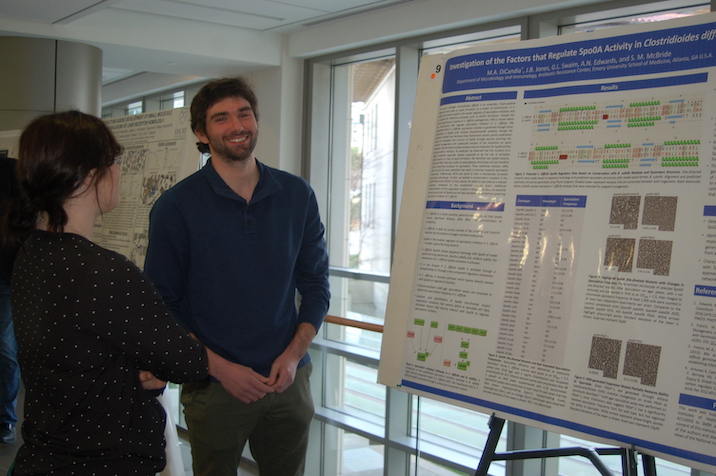 Student presenting poster