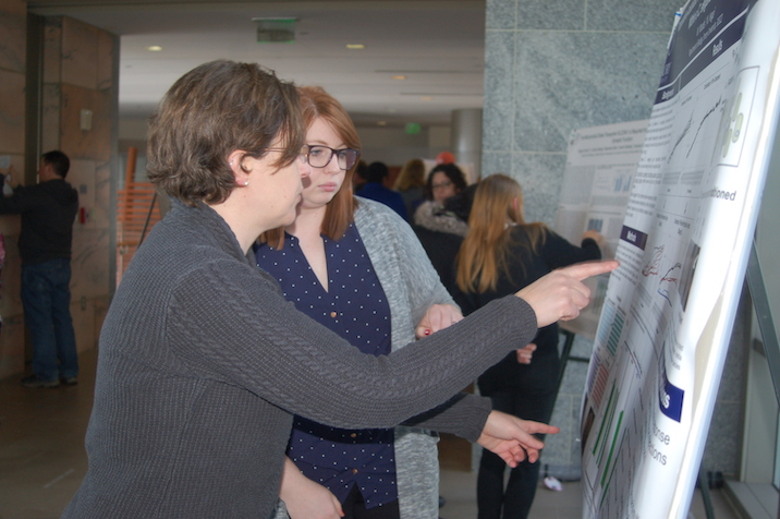 Student presenting poster