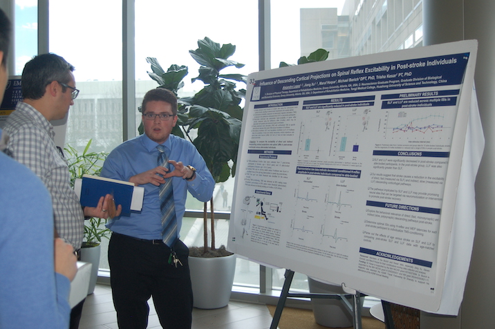 Student presenting poster