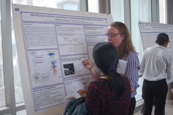 Student presenting poster
