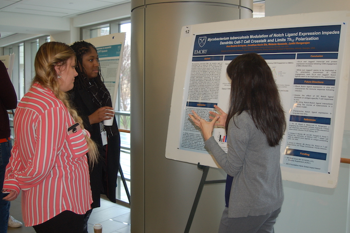 Student presenting poster