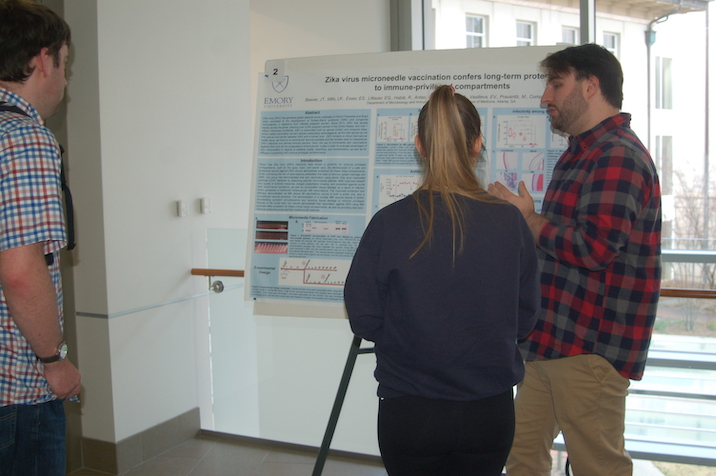 Student presenting poster