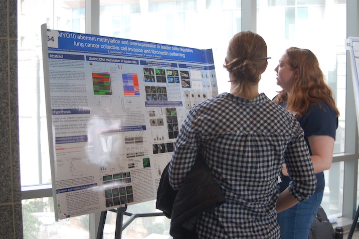 Student presenting poster