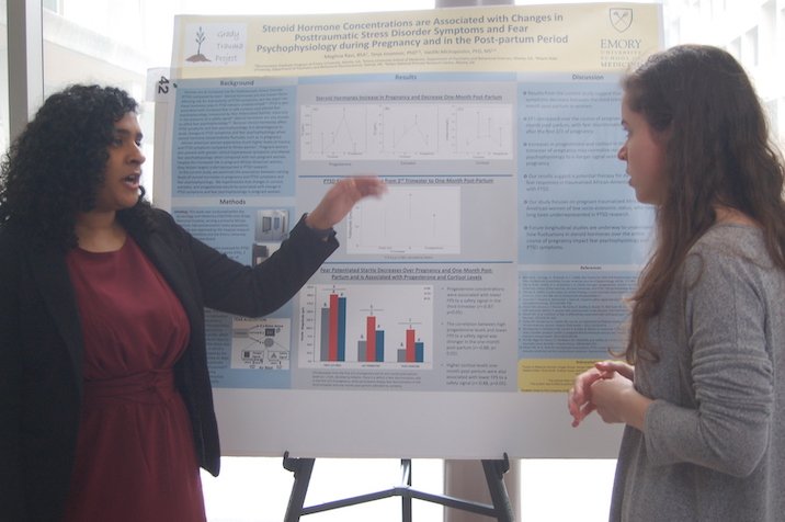 Student presenting poster