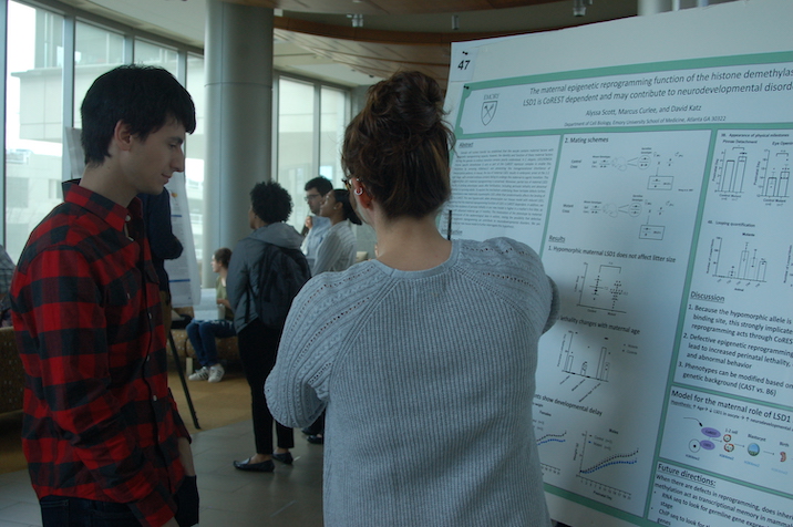 Student presenting poster