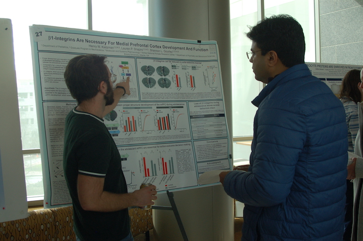 Student presenting poster